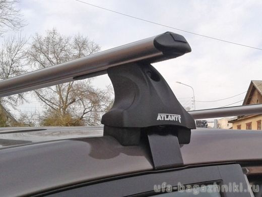 Багажник на крышу на Mitsubishi L200 2015-..., Атлант, аэродинамические дуги, опора Е