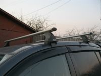 Багажник на крышу на Mitsubishi L200, Атлант, аэродинамические дуги, опора Е