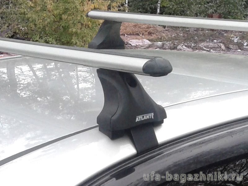 Багажник на крышу Mitsubishi Lancer 10 sedan, Атлант: аэродинамические дуги и опоры типа Е