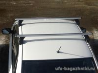 Багажник на крышу Mitsubishi Lancer 10 sedan, Атлант: аэродинамические дуги и опоры типа Е