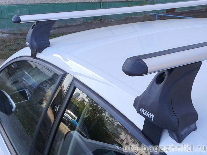 Багажник на крышу Volkswagen Polo sedan, Атлант: аэродинамические дуги и опоры типа Е