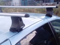 Багажник на крышу Nissan Tino (без рейлингов), Атлант, аэродинамические дуги